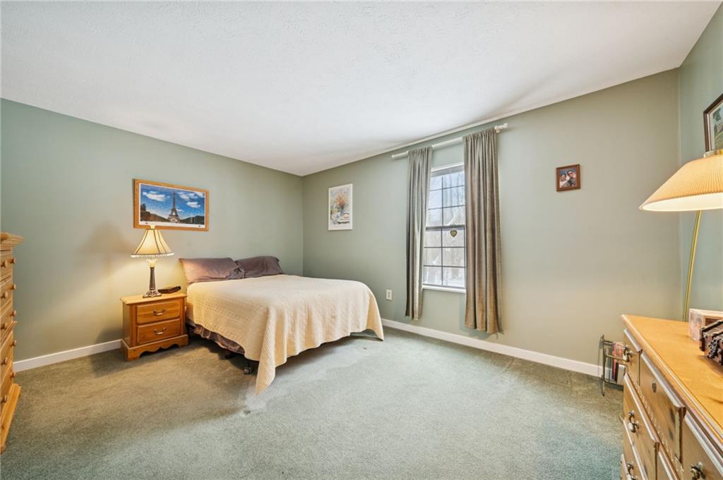 3151 Seneca Court Gibsonia, PA 15044 - Photo 18 of 38 a bed room with a bed and a wall painting