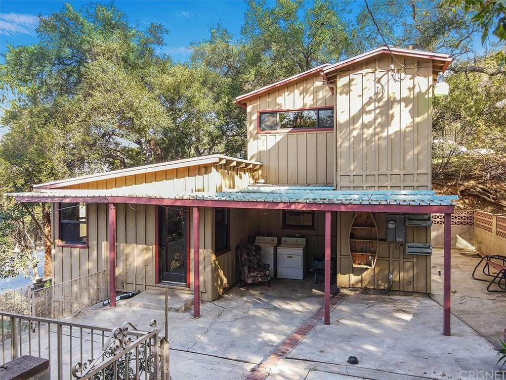 6748 Santa Susana Pass Road Simi Valley, CA 93063 - Photo 1 of 1 a view of a house with backyard and sitting area