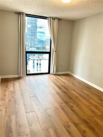 a view of an empty room and window