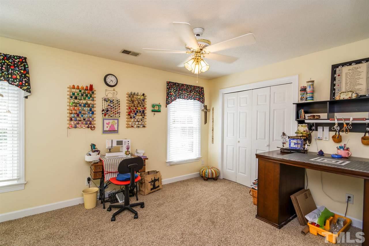 5912 Hampton Ridge Road Raleigh, NC 27603 - Photo 11 of 22 a room with furniture and musical instruments