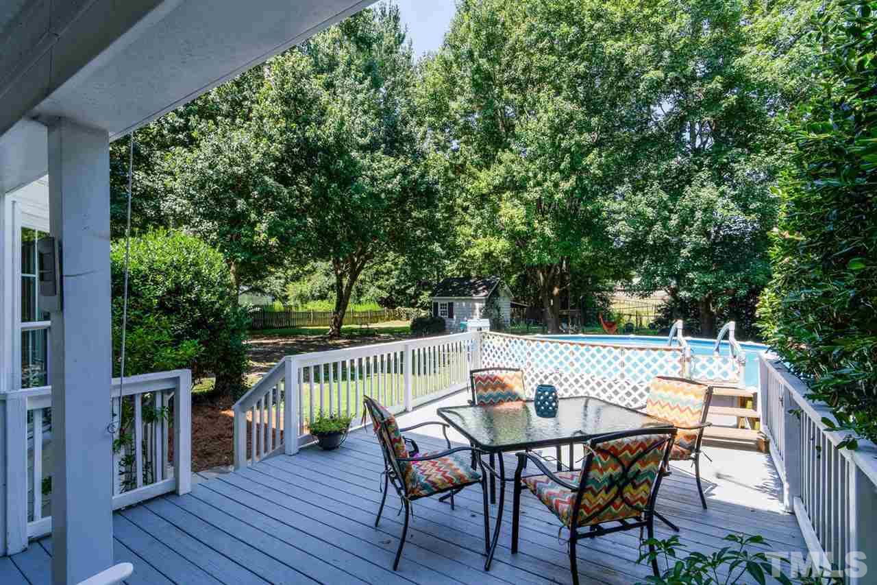 5912 Hampton Ridge Road Raleigh, NC 27603 - Photo 15 of 22 a view of a table and chairs on the roof deck
