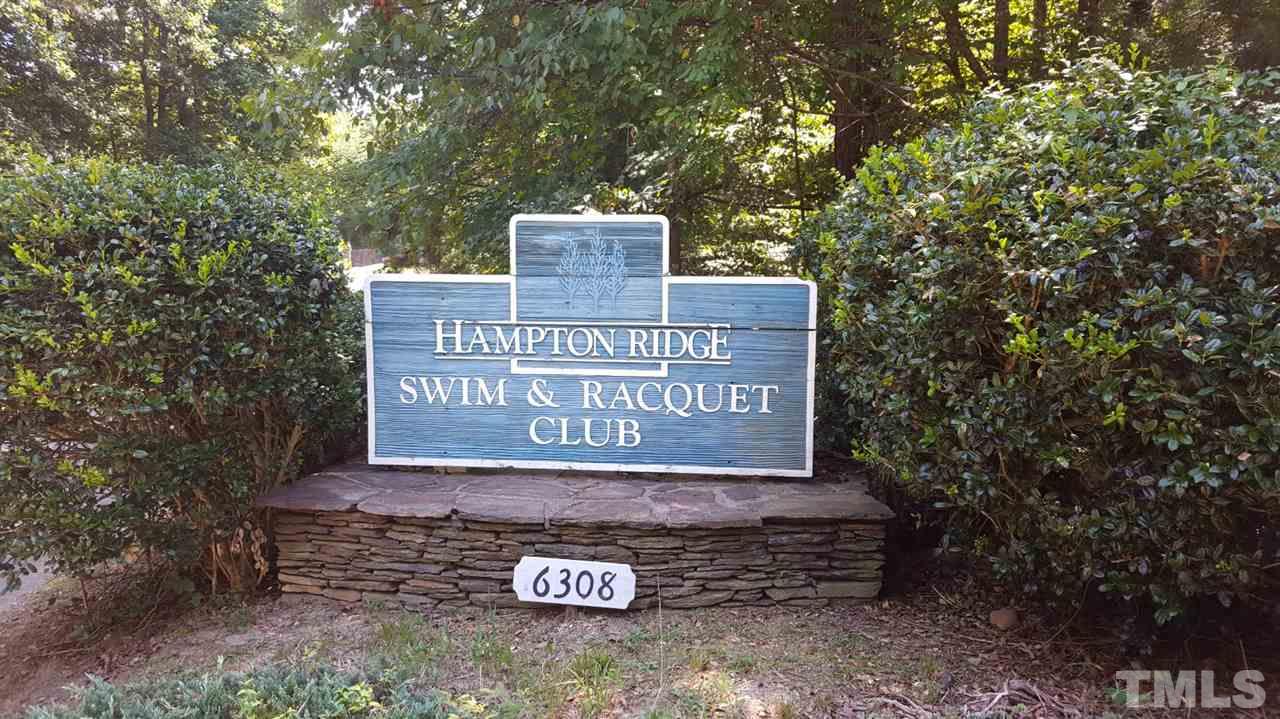 5912 Hampton Ridge Road Raleigh, NC 27603 - Photo 21 of 22 a sign that is sitting on a brick wall