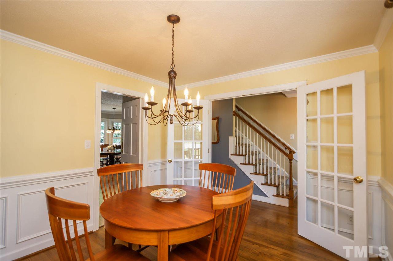 5912 Hampton Ridge Road Raleigh, NC 27603 - Photo 7 of 22 a view of a dining room with furniture window and wooden floor