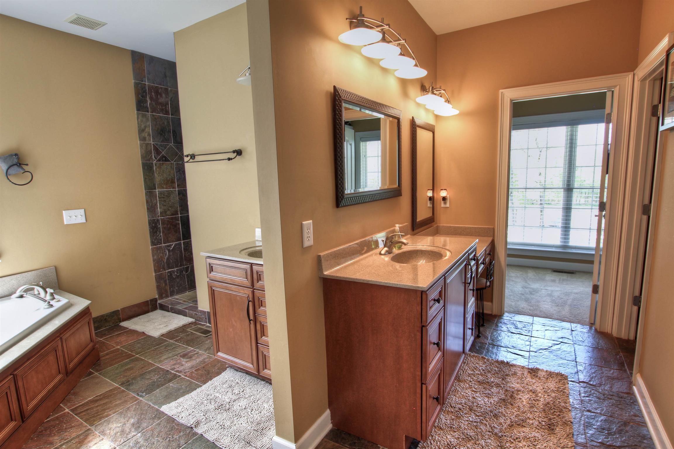 9185 Arnold Road Christiana, TN 37037 - Photo 8 of 30 Spacious master bath includes large walk-in closet with built-ins.