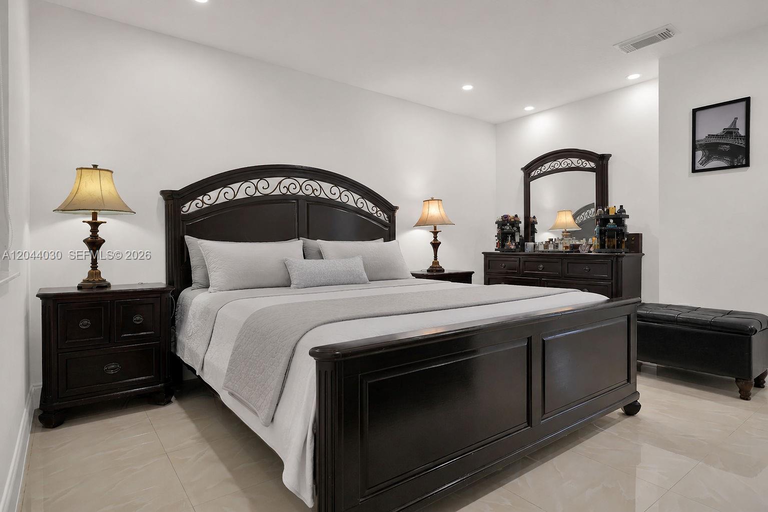 12551 Southwest 223rd Street Miami, FL 33170 - Photo 14 of 35 a bedroom with a bed and a dresser