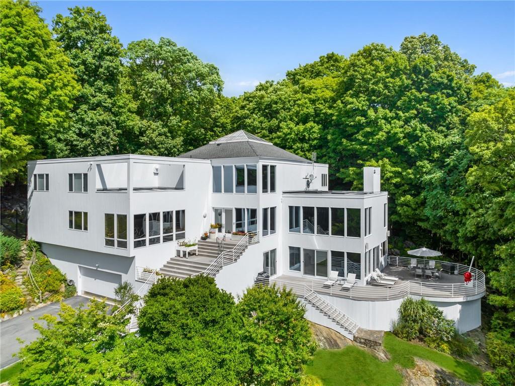 Welcome to 25 High Meadows, Mt Kico/Chappaqua, a 6 bedroom 6.1 bath 8661 sq ft contemporary  architectural masterpeice beautlfully sited on 3.8 private acres at the end of a cul-de-sac