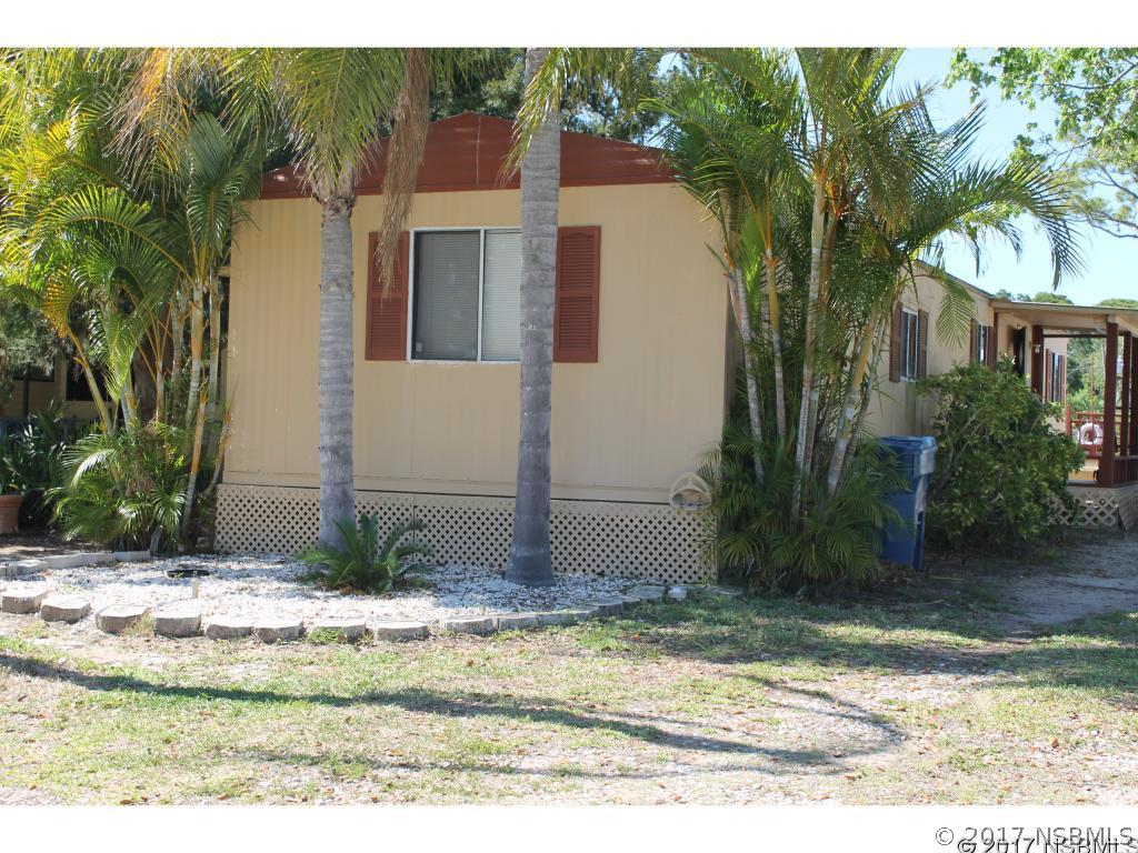 127 Charles Street Edgewater, FL 32141 - Photo 2 of 10 a view of a house with a yard and plants