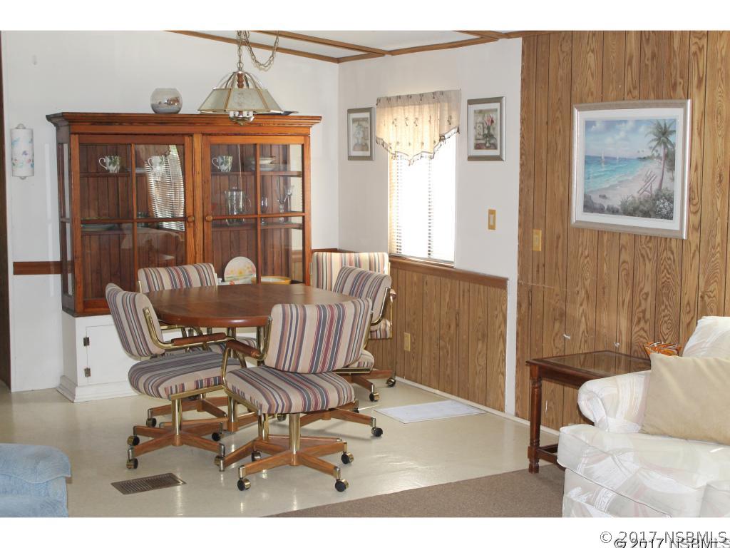 127 Charles Street Edgewater, FL 32141 - Photo 8 of 10 a view of a dining room with furniture window and outside view