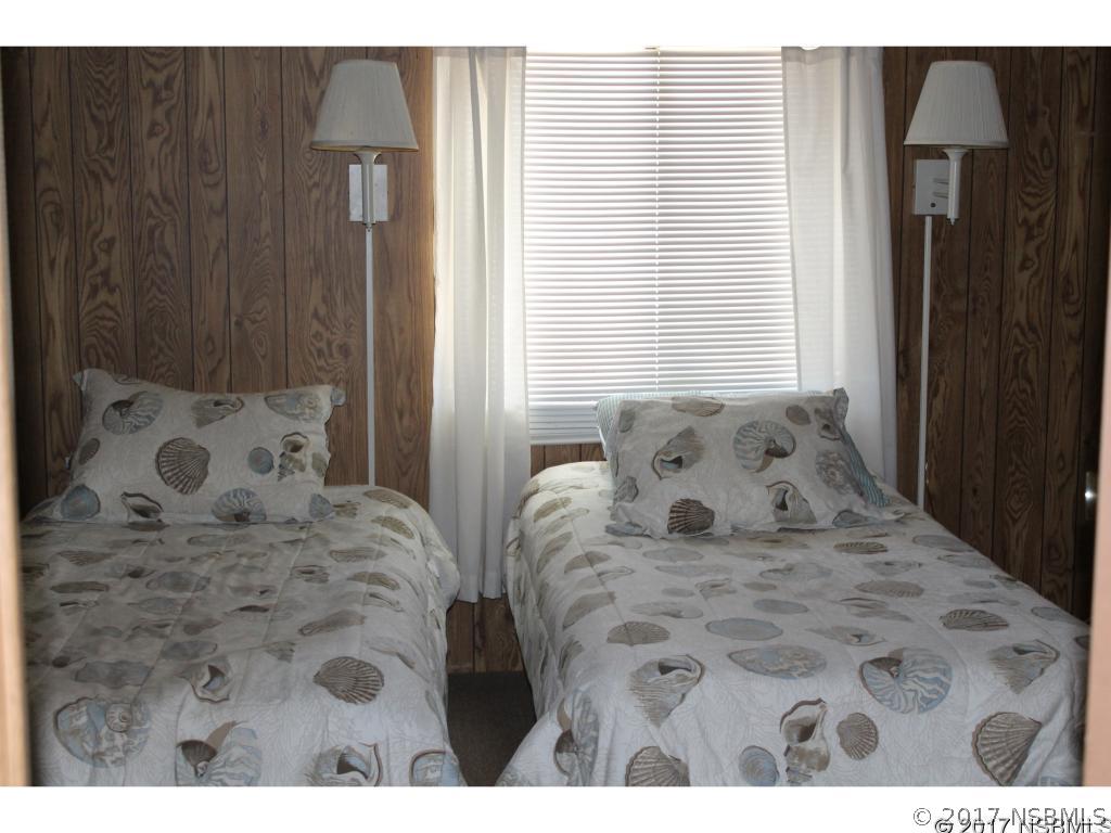 127 Charles Street Edgewater, FL 32141 - Photo 9 of 10 a view of bedroom with window and furniture