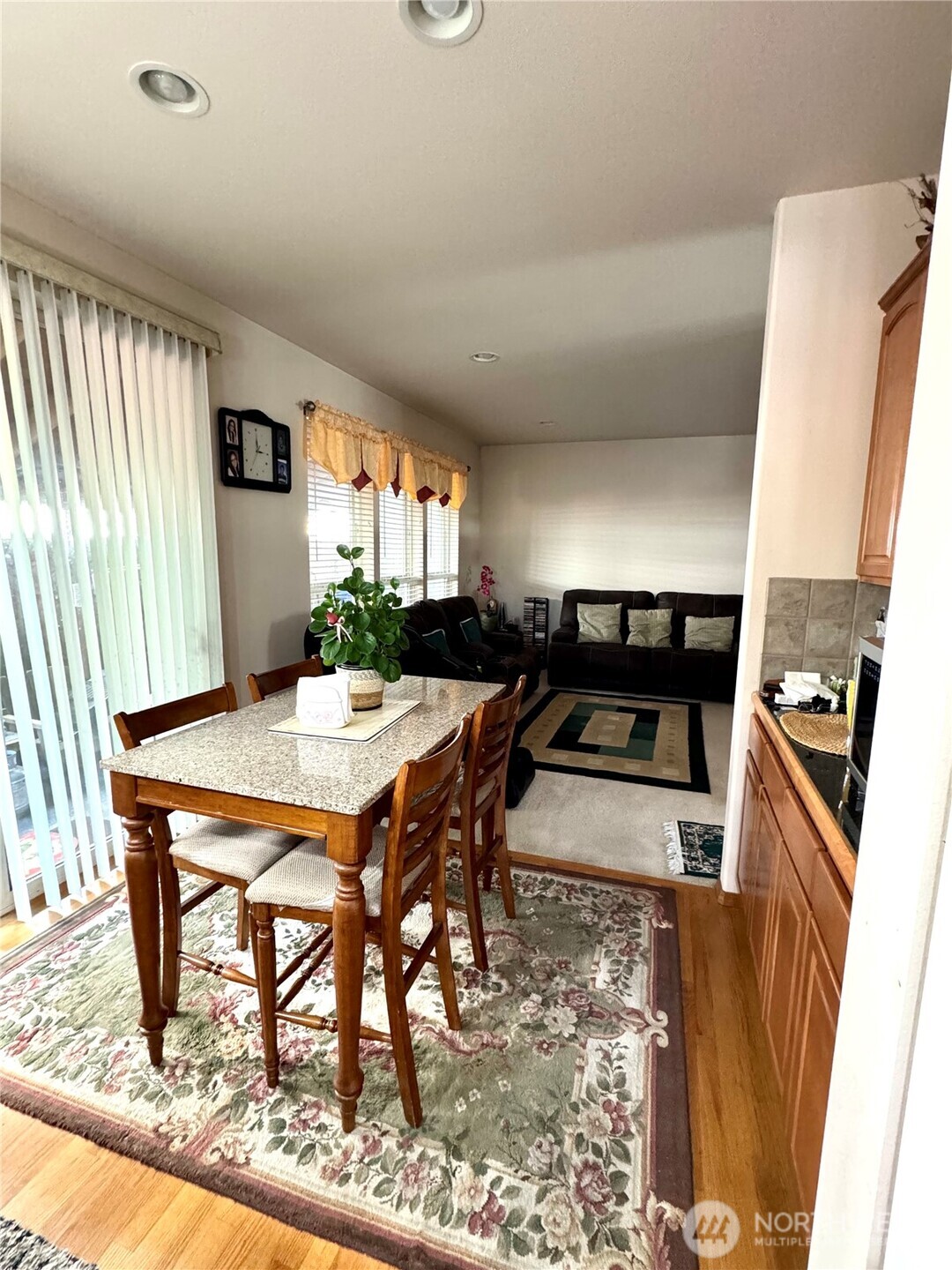 1612 Holbrook Avenue Everett, WA 98203 - Photo 8 of 23 a dining room with a table chairs and kitchen view