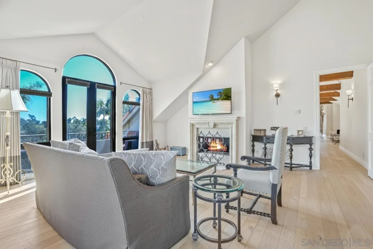 5305 La Crescenta Road Rancho Santa Fe, CA 92067 - Photo 50 of 64 Secondary primary suite has nice sitting area, fireplace and wonderful view from the balcony. Paint virtually enhanced to match FR