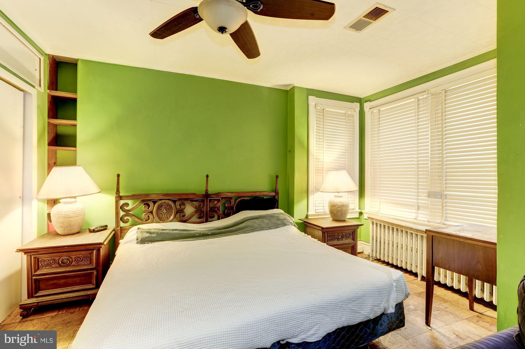 1216 D Street Northeast Washington, DC 20002 - Photo 6 of 18 a bedroom with a bed and window