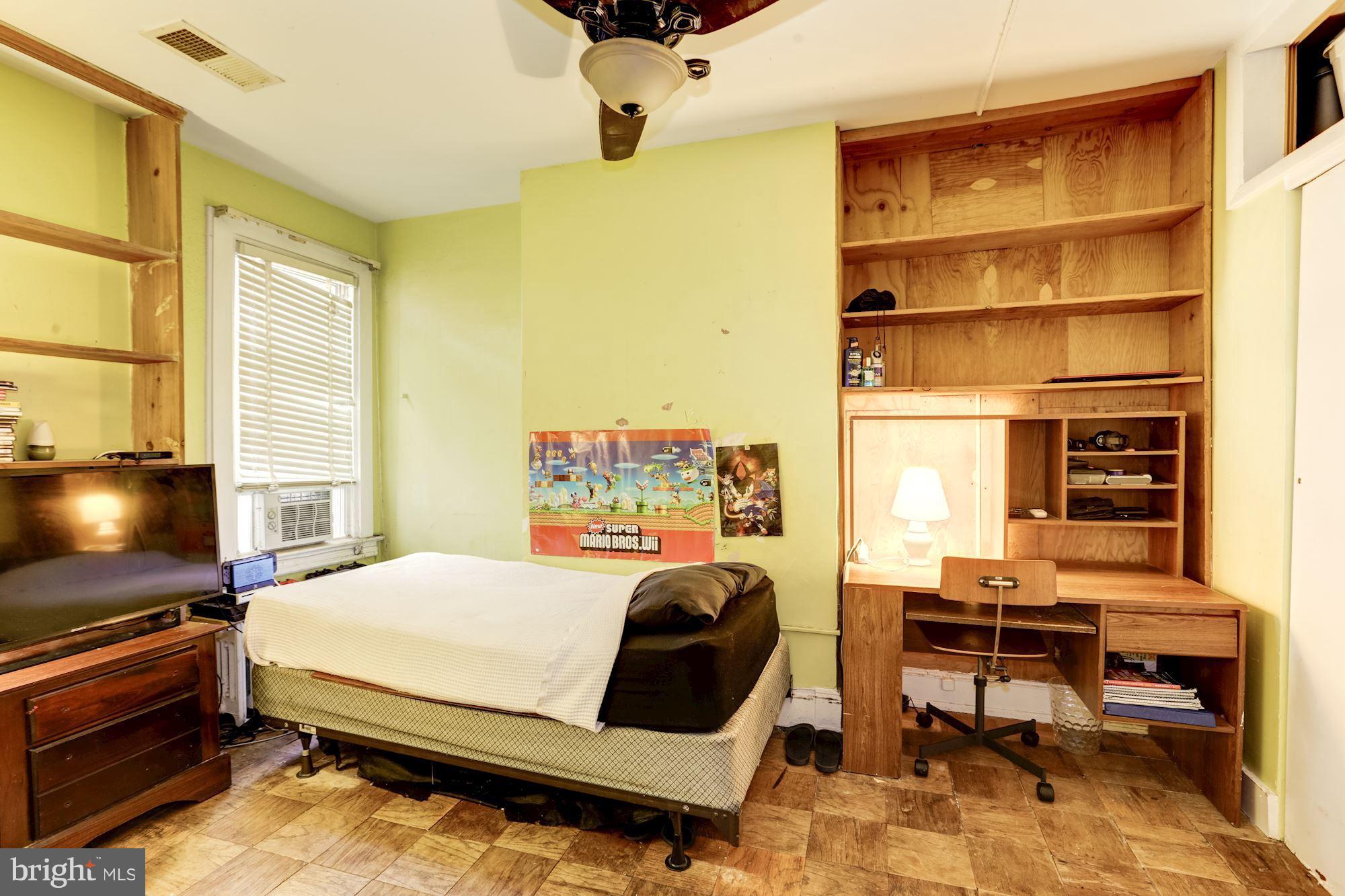 1216 D Street Northeast Washington, DC 20002 - Photo 7 of 18 a bedroom with furniture and a window