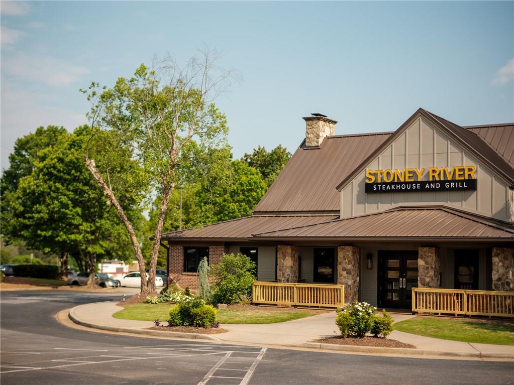 508 Whatton Road, Unit 4 Johns Creek, GA 30022 - Photo 29 of 31 a front view of a house with garden