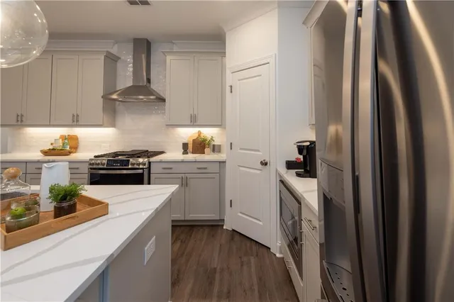 a kitchen with a sink appliances and cabinets