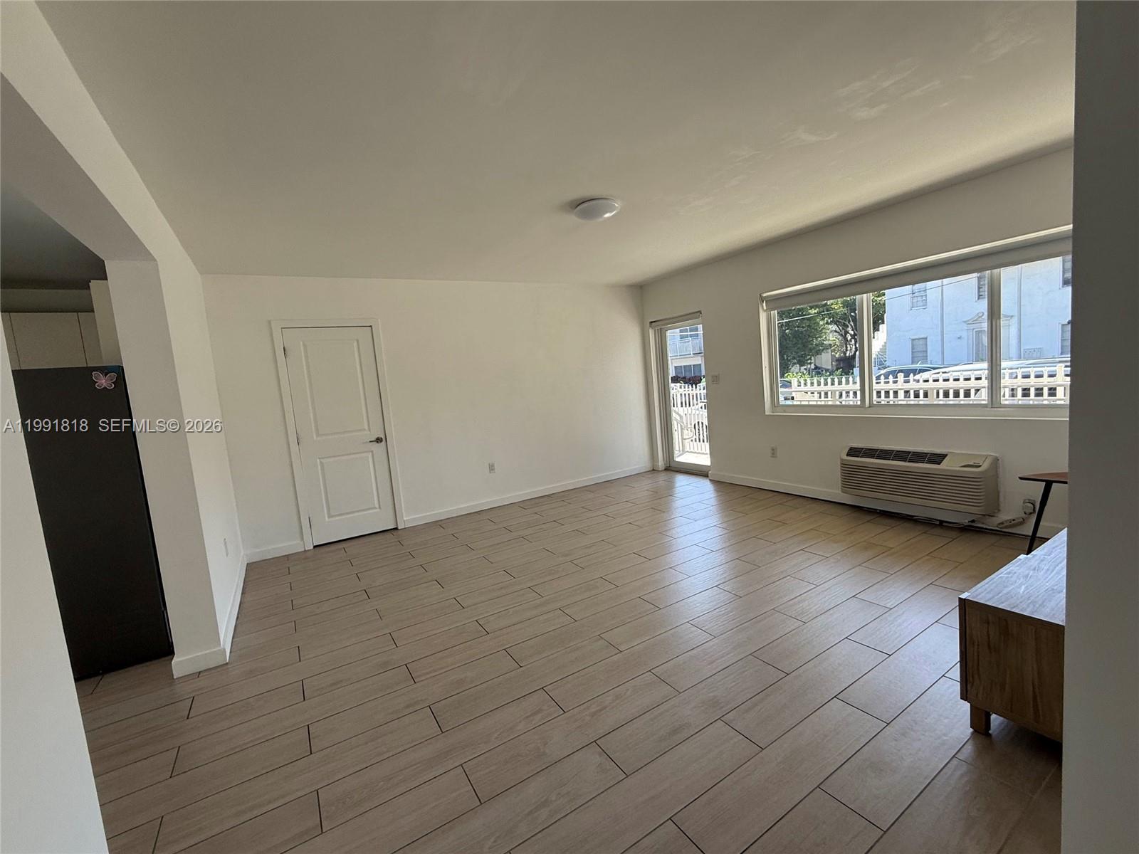 625 77th Street, Unit 2 Miami Beach, FL 33141 - Photo 14 of 17 an empty room with windows