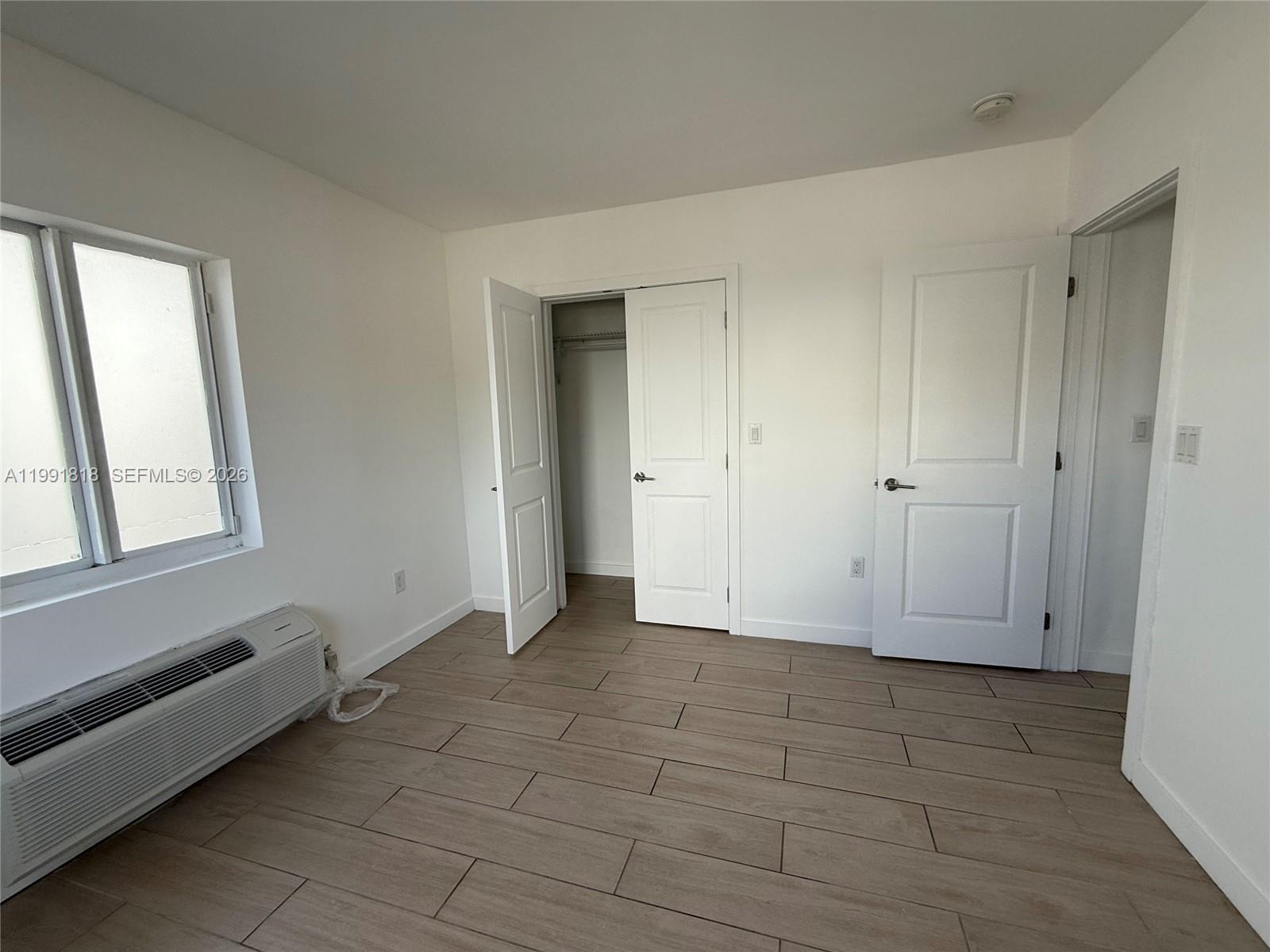 625 77th Street, Unit 2 Miami Beach, FL 33141 - Photo 15 of 17 a view of an empty room with window