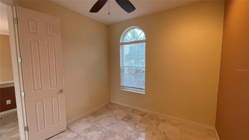 10812 Bullrush Terrace Lakewood Ranch, FL 34202 - Photo 13 of 44 an empty room with windows