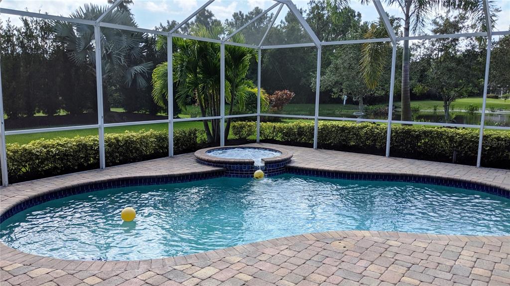 10812 Bullrush Terrace Lakewood Ranch, FL 34202 - Photo 2 of 44 a view of a backyard with sitting area