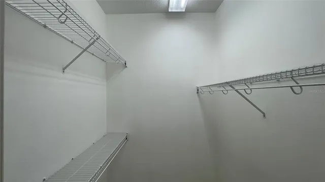 a view of a room with racks on the wall