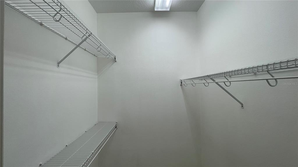 10812 Bullrush Terrace Lakewood Ranch, FL 34202 - Photo 24 of 44 a view of a room with racks on the wall