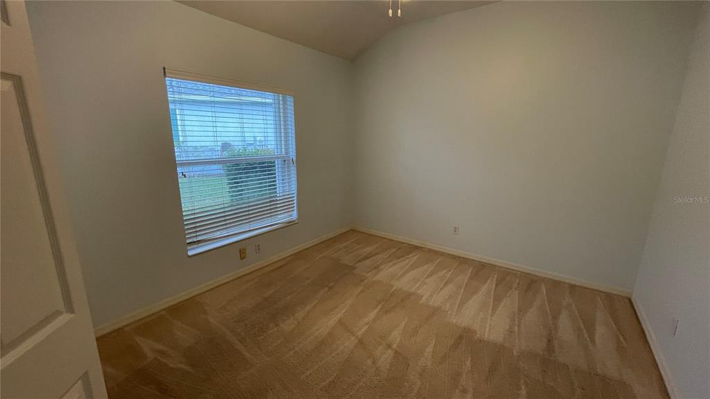 10812 Bullrush Terrace Lakewood Ranch, FL 34202 - Photo 34 of 44 a view of an empty room with a window