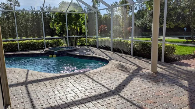 a view of a backyard with sitting area and furniture