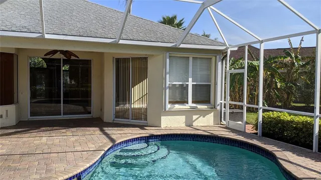 a view of a house with backyard and porch