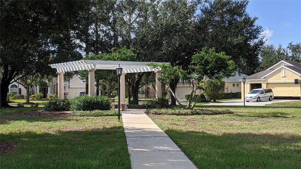 10812 Bullrush Terrace Lakewood Ranch, FL 34202 - Photo 43 of 44 a front view of a house with a yard