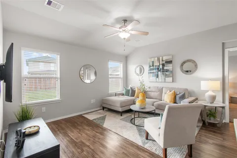 a living room with furniture and a window