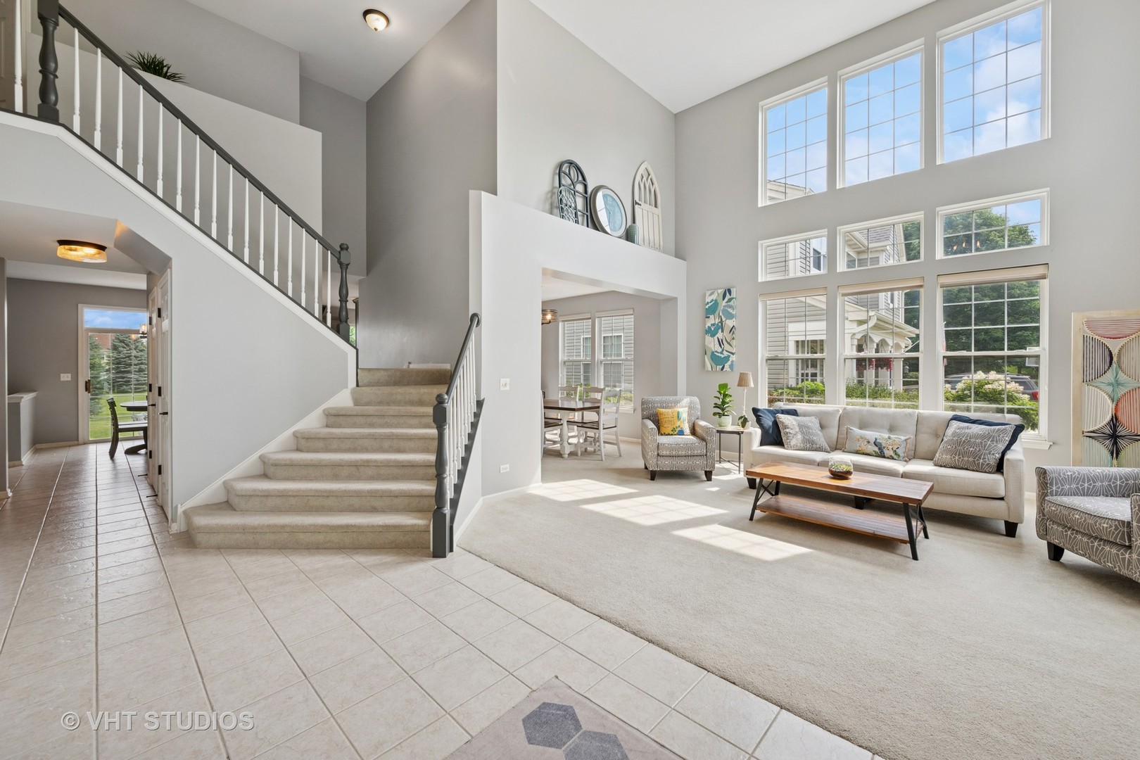 390 Sterling Circle Cary, IL 60013 - Photo 2 of 55 a living room with furniture and a floor to ceiling window