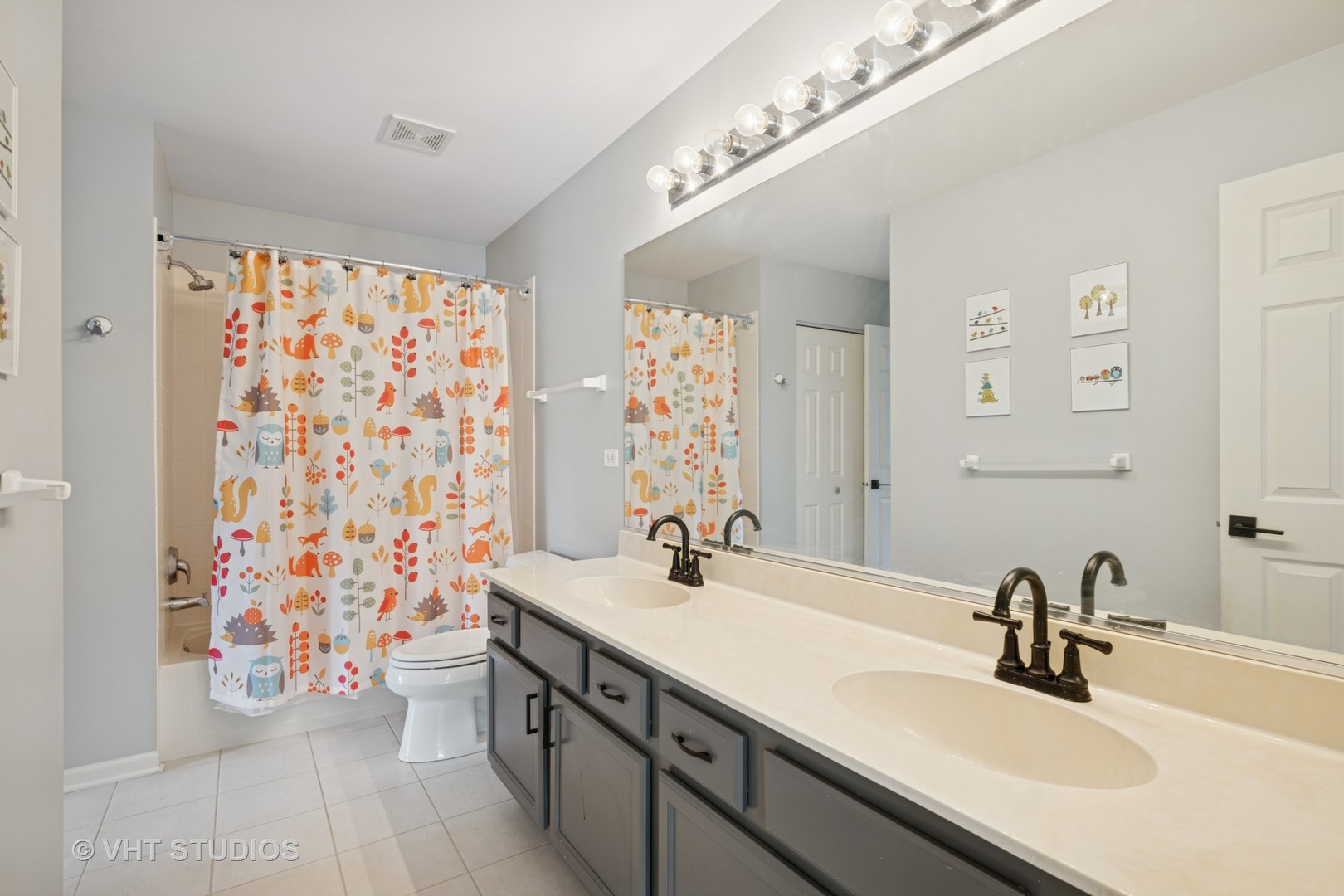 390 Sterling Circle Cary, IL 60013 - Photo 23 of 55 a bathroom with a sink mirror and vanity
