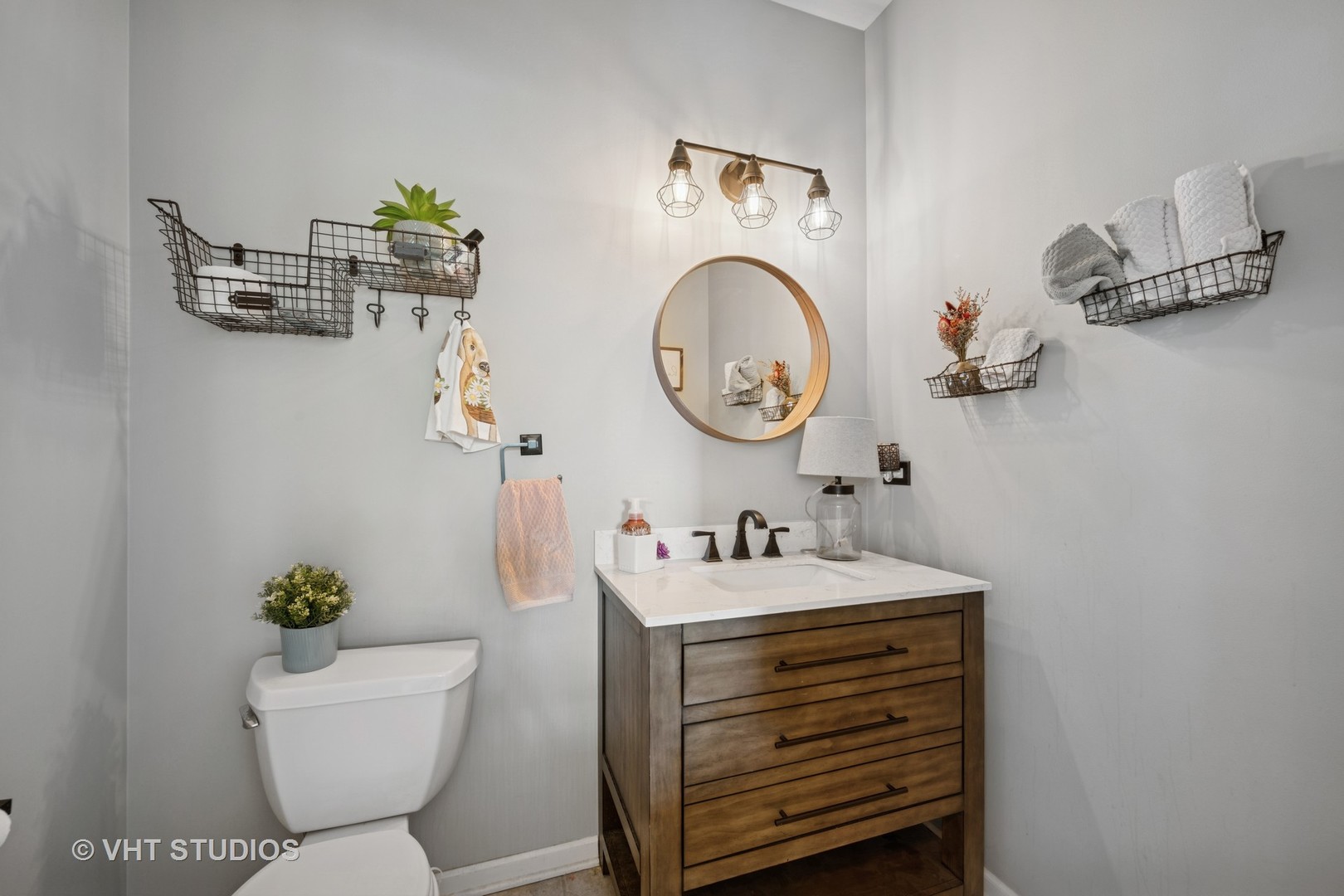 390 Sterling Circle Cary, IL 60013 - Photo 31 of 55 a bathroom with a toilet sink and mirror