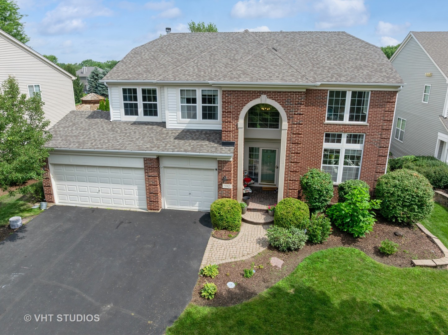 390 Sterling Circle Cary, IL 60013 - Photo 37 of 55 a front view of a house with garden