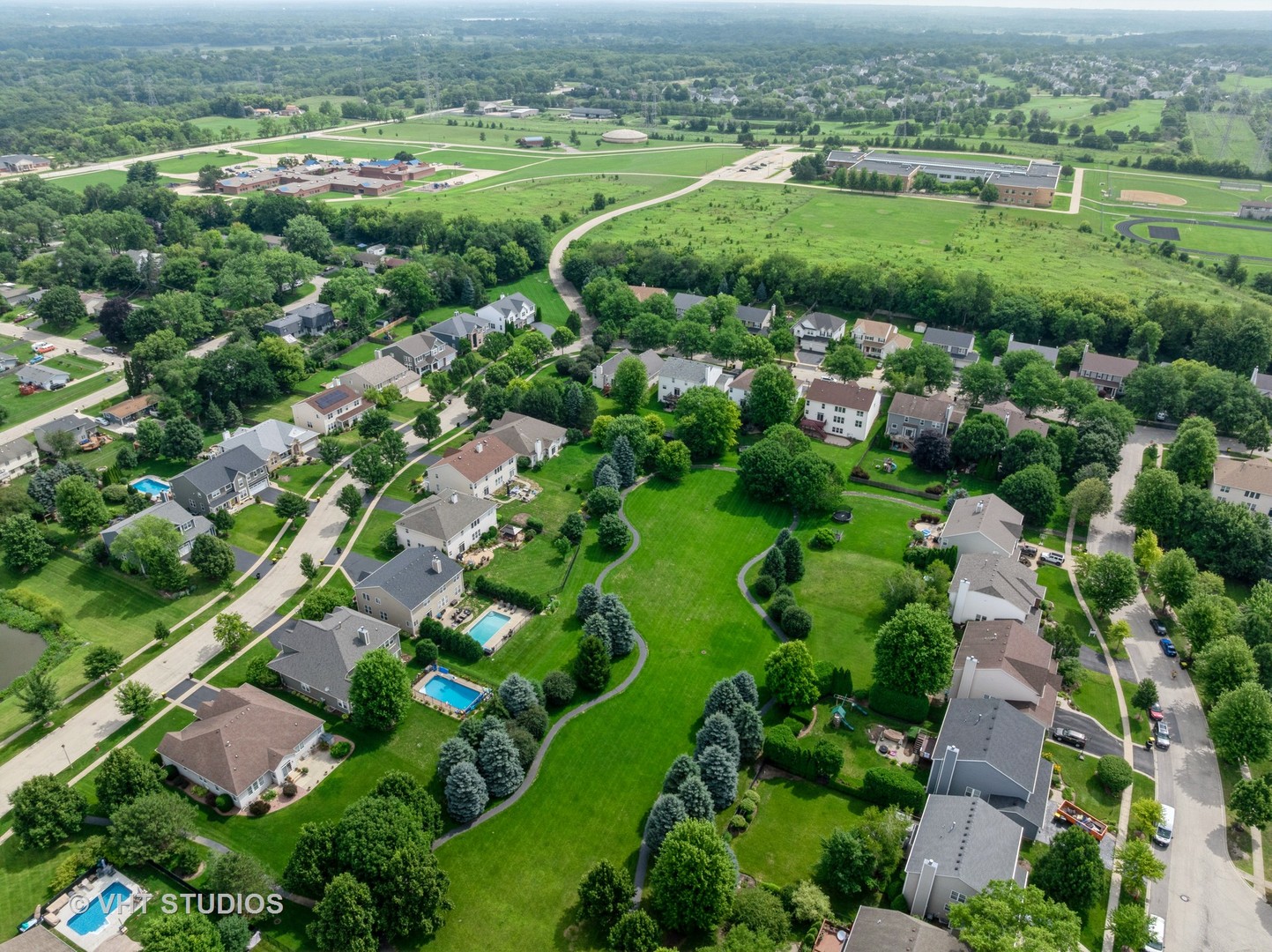 390 Sterling Circle Cary, IL 60013 - Photo 44 of 55 an aerial view of a city with lots of residential buildings