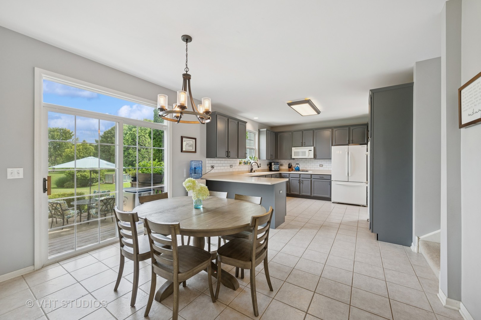 390 Sterling Circle Cary, IL 60013 - Photo 10 of 55 a dining room with furniture and window