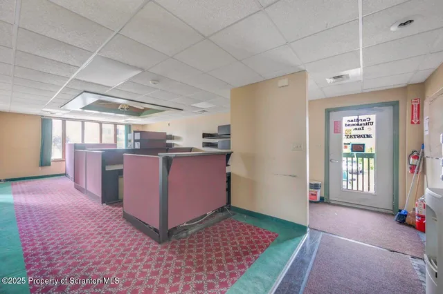 a spacious bathroom with a toilet sink and mirror