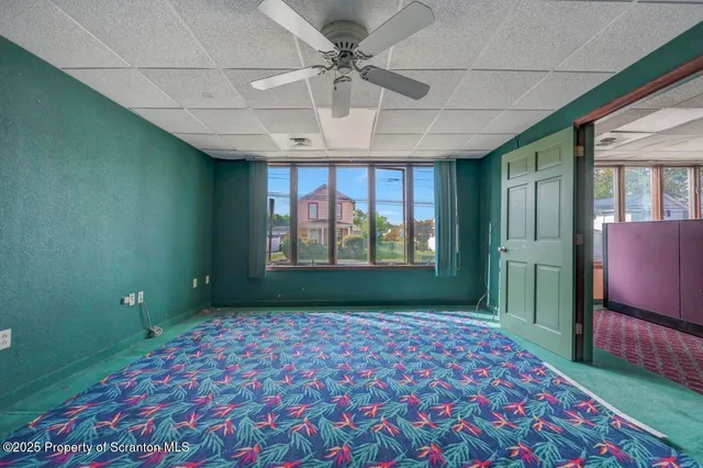 a view of hallway with wooden floor