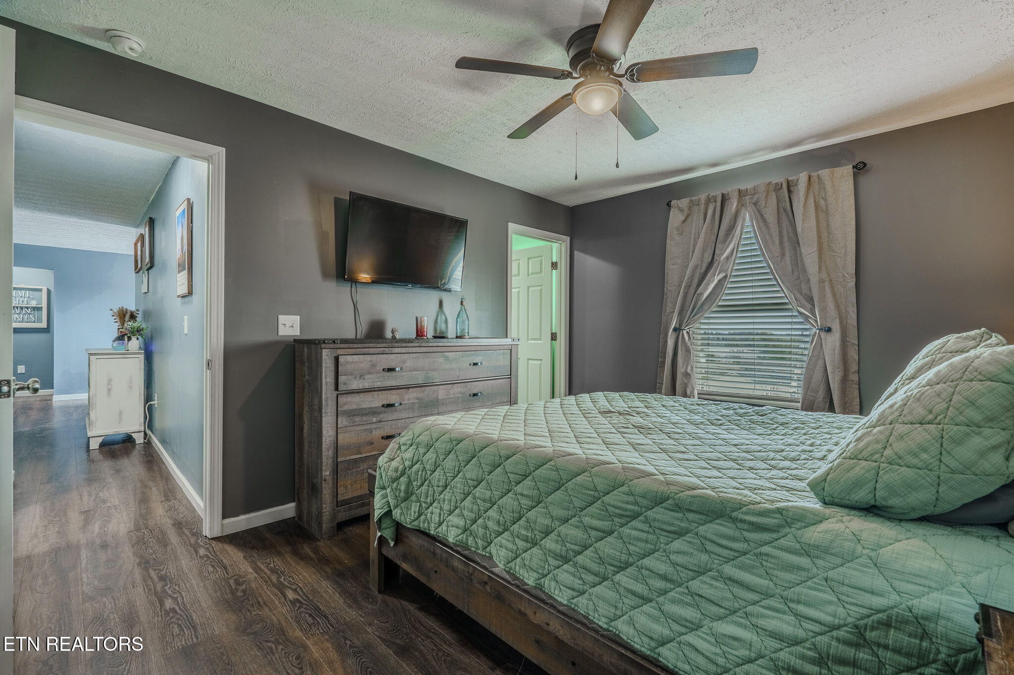 3215 Smith Road White Pine, TN 37890 - Photo 7 of 28 a bedroom with a bed and a flat screen tv