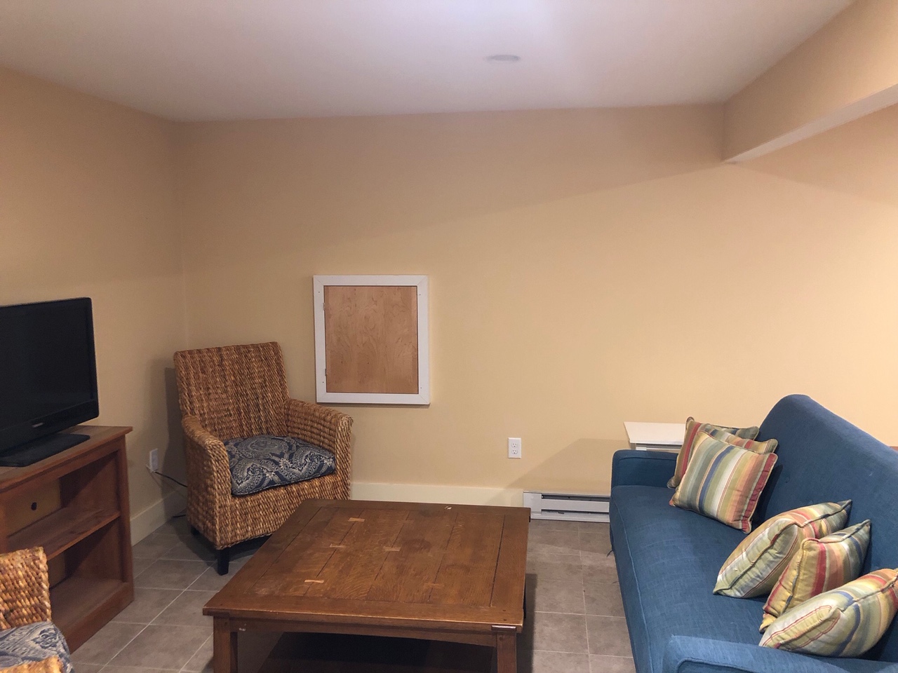 3 A Sun Island Road, Unit 4 Nantucket, MA 02554 - Photo 13 of 17 a living room with furniture and a flat screen tv