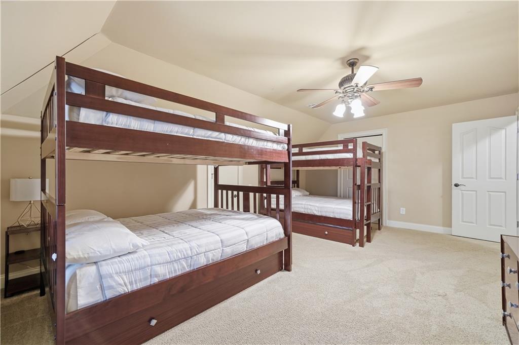 97 Eagle Ridge Trail Cleveland, GA 30528 - Photo 42 of 58 a bedroom with a bed and a ceiling fan