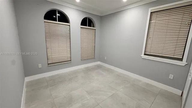 an empty room with a mirror