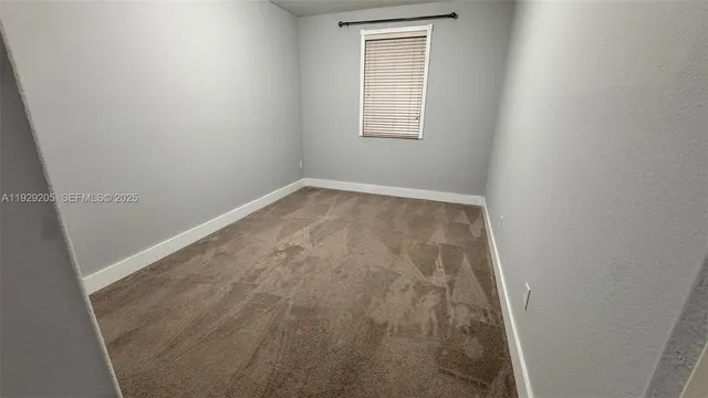 a bathroom with a toilet a sink and shower