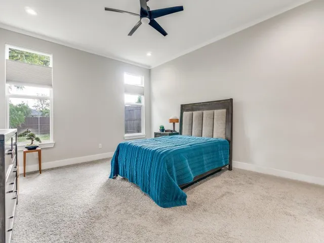 a bedroom with a bed and window