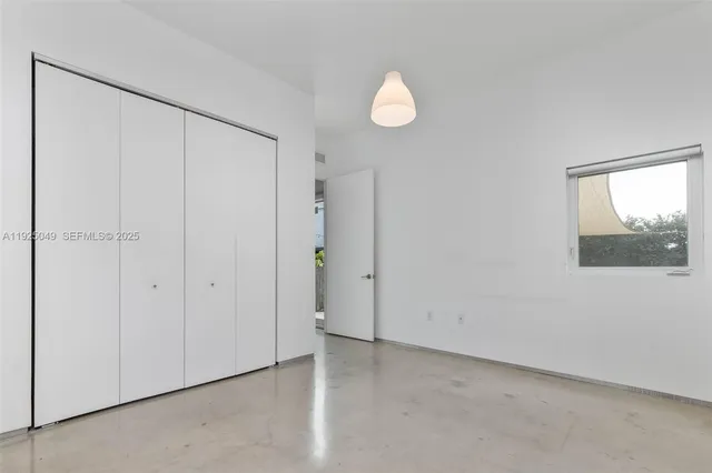 a view of an empty room and window