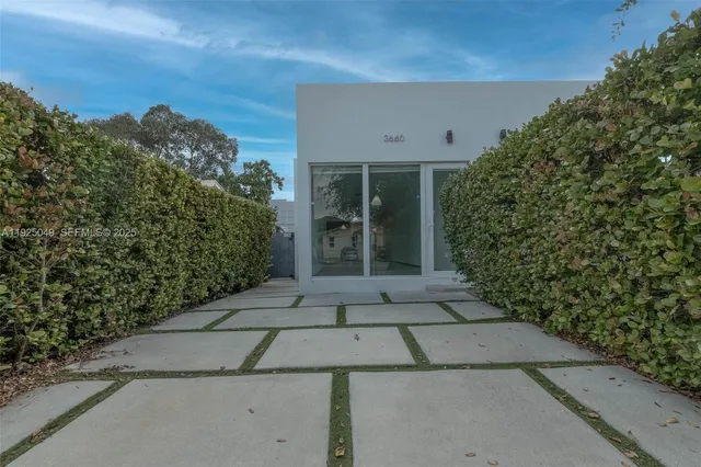 a view of a pathway with a yard