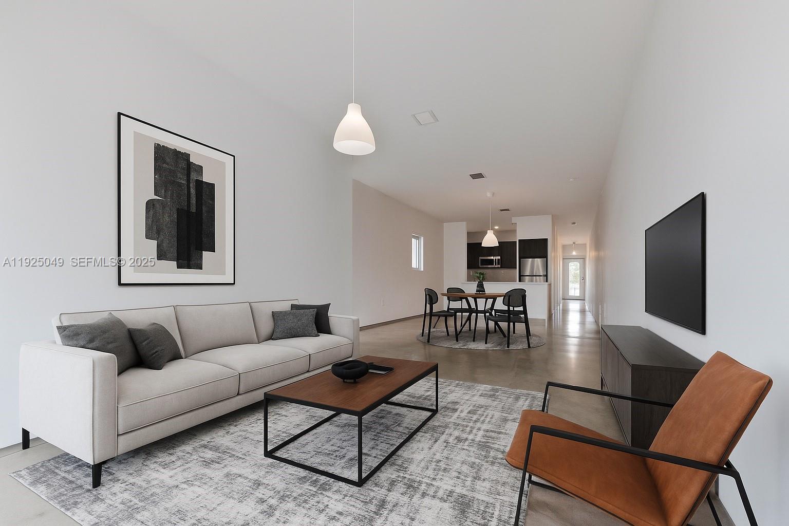 3660 Southwest 24th Terrace, Unit 3660 Miami, FL 33145 - Photo 2 of 21 a living room with furniture and a flat screen tv