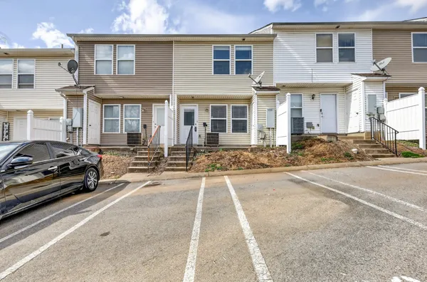 a view of a car park in front of a building