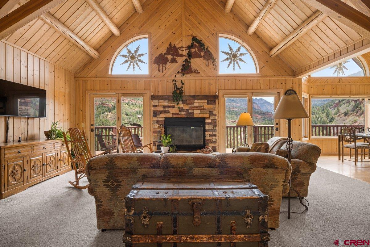 a bedroom with furniture and a fireplace