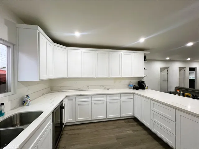a kitchen with a sink cabinets and window